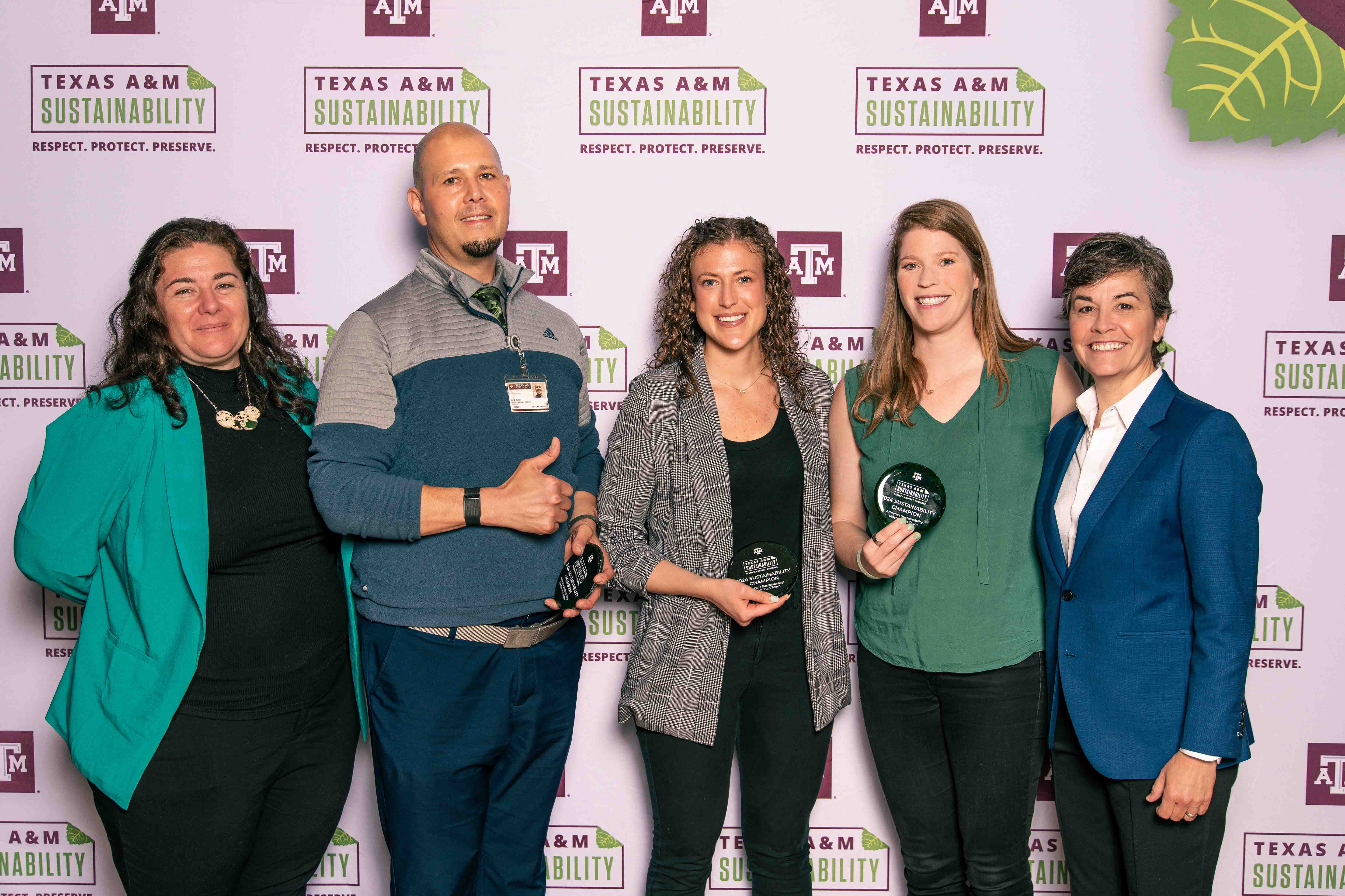 Recipients accepting the Sustainability Champion Team Award.